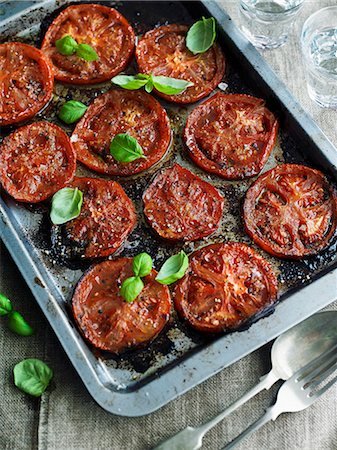 roasted tomatoes above - Oven-baked tomatoes with basil Stock Photo - Premium Royalty-Free, Code: 659-08903016