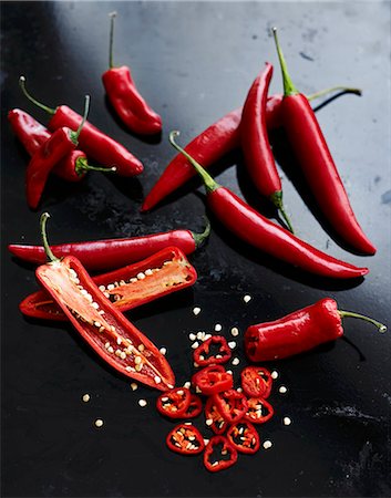 food and black background - Red chilli peppers, halved and cut into rings Stock Photo - Premium Royalty-Free, Code: 659-08903013