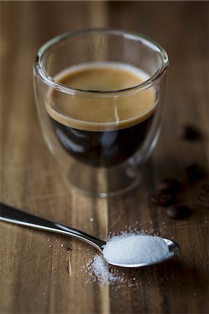 simsearch:659-08906370,k - A glass of espresso with a spoonful of sugar Photographie de stock - Premium Libres de Droits, Code: 659-08903054