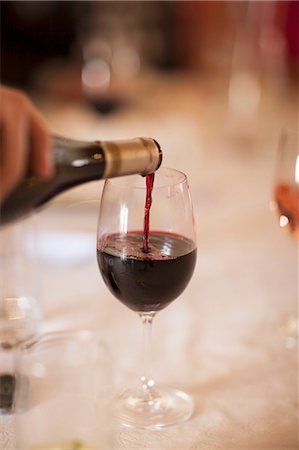 simsearch:659-06155174,k - Red wine being poured from a bottle into a glass Stock Photo - Premium Royalty-Free, Code: 659-08903351