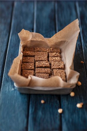 simsearch:659-08904500,k - Hazelnut milk sweets on a piece of baking paper in a metal tin Fotografie stock - Premium Royalty-Free, Codice: 659-08903530