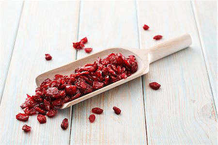 soft fruit - Dried cranberries on a wooden scoop Stock Photo - Premium Royalty-Free, Code: 659-08940087