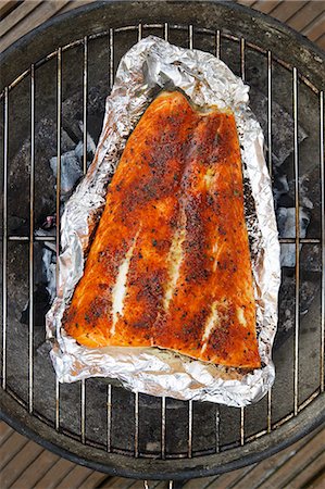 Spiced salmon in aluminium foil on a barbecue Stock Photo - Premium Royalty-Free, Code: 659-08940133