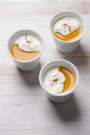 simsearch:659-08147712,k - Turmeric panna cotta with coconut cream and saffron Photographie de stock - Premium Libres de Droits, Code: 659-08940389