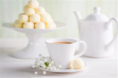 Coconut pralines served with coffee Stock Photo - Premium Royalty-Free, Code: 659-08940478