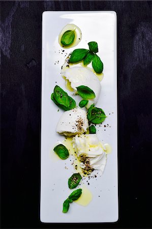 Mozzarella with basil, pepper and olive oil Stock Photo - Premium Royalty-Free, Code: 659-08940483