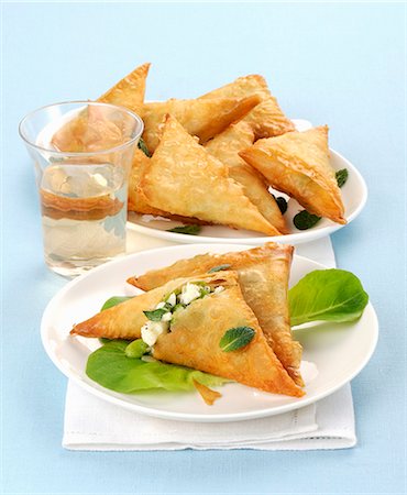 simsearch:659-03520857,k - Filo pastry triangles filled with feta cheese and broad beans Photographie de stock - Premium Libres de Droits, Code: 659-08940548