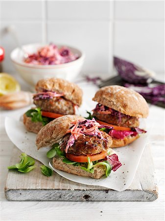 purple cabbage salad - Pork burgers with sage and a red cabbage salad Stock Photo - Premium Royalty-Free, Code: 659-08940621