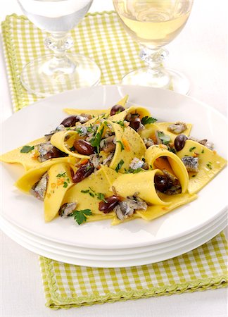 Stracci con alici (fresh pasta with anchovies and olives, Italy) Stock Photo - Premium Royalty-Free, Code: 659-08940771