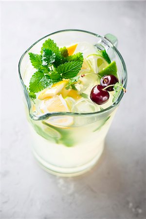 simsearch:659-08906339,k - Pitcher of Lemonade with Glass with Ice Stock Photo - Premium Royalty-Free, Code: 659-08940934