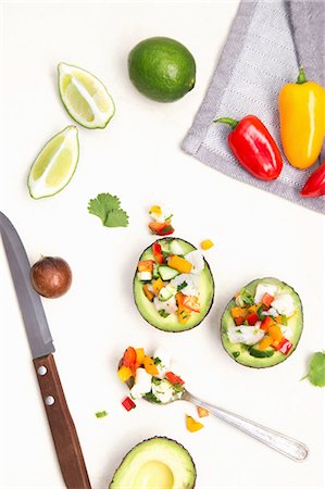 White fish ceviche with cucumber, peppers and coriander served in an avocado Stock Photo - Premium Royalty-Free, Code: 659-08941022