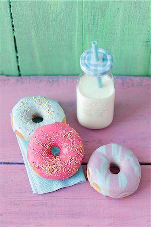 shabby - Doughnuts with a colorful sugar glaze and a milk bottle Stock Photo - Premium Royalty-Free, Code: 659-09124316