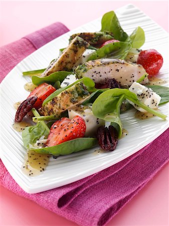 simsearch:659-06151520,k - Grilled chicken with feta cheese strawberries pecans baby spinach salad with honey mustard and poppyseed dressing Stock Photo - Premium Royalty-Free, Code: 659-09124612