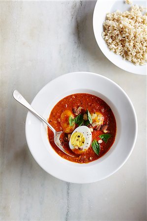 simsearch:659-07068894,k - Egg curry with tomatoes, nuts and rice Fotografie stock - Premium Royalty-Free, Codice: 659-09125197