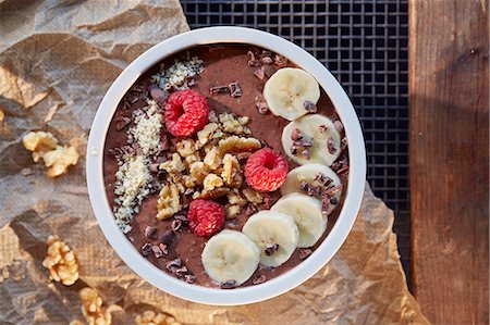 simsearch:659-09125465,k - A smoothie bowl with chocolate, banana, raspberries and walnuts Stock Photo - Premium Royalty-Free, Code: 659-09125268