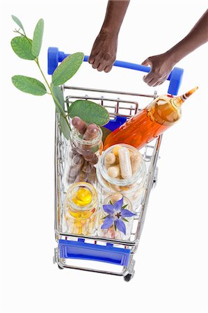 Hands pushing a shopping trolley full of pharmaceutical products Stock Photo - Premium Royalty-Free, Code: 659-09125339