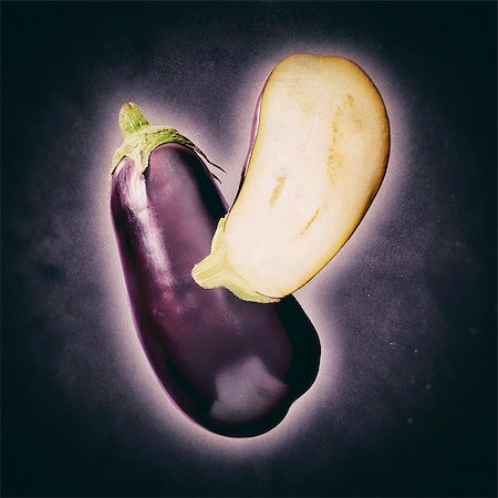 Aubergines, whole and halved Stock Photo - Premium Royalty-Free, Code: 659-09125566