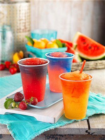 summer drink nobody - Three different fruity slushies in plastic cups Stock Photo - Premium Royalty-Free, Code: 659-09125603