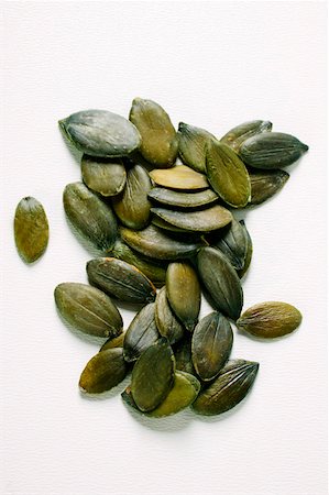 pumpkin seed - Pumpkin seeds Foto de stock - Sin royalties Premium, Código: 659-01844138