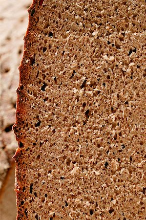 farmhouse bread - Farmhouse bread, slices cut (detail) Foto de stock - Sin royalties Premium, Código: 659-01844147