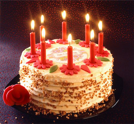 Birthday cake with burning candles Stock Photo - Premium Royalty-Free, Code: 659-01844335