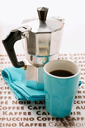 simsearch:659-01856319,k - Blue espresso cup in front of espresso machine Foto de stock - Sin royalties Premium, Código: 659-01844438