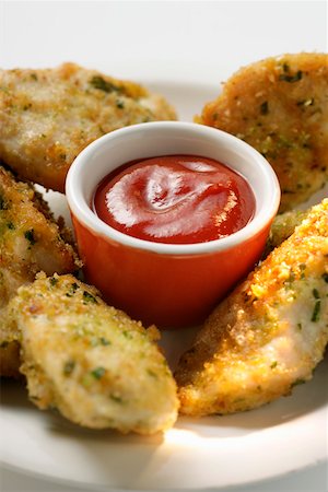 simsearch:659-01847449,k - Chicken nuggets in herb panade with ketchup Stock Photo - Premium Royalty-Free, Code: 659-01844451