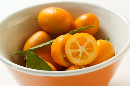 Kumquats in orange bowl Stock Photo - Premium Royalty-Free, Code: 659-01844487