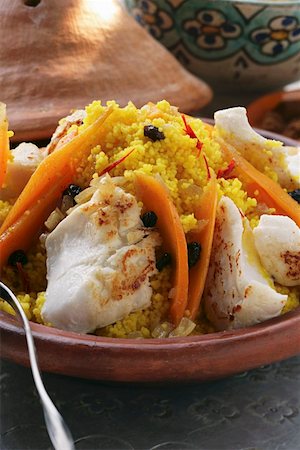 Saffron couscous with fish, carrots and raisins (N. Africa) Stock Photo - Premium Royalty-Free, Code: 659-01844515