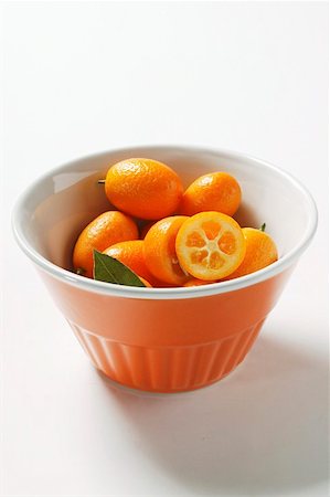 Kumquats in orange bowl Stock Photo - Premium Royalty-Free, Code: 659-01844533