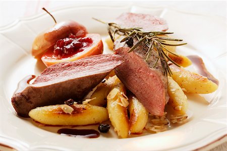 simsearch:659-01844613,k - Venison fillet with potato noodles, rosemary & cranberry apple Stock Photo - Premium Royalty-Free, Code: 659-01844607