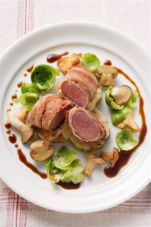 simsearch:659-01850954,k - Venison fillet in bacon, forest mushrooms & Brussels sprouts Stock Photo - Premium Royalty-Free, Code: 659-01844611