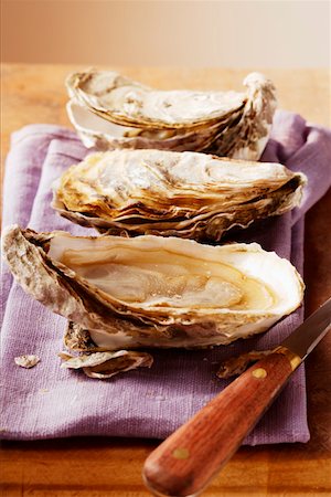 raw oyster - Fresh oysters on purple cloth Stock Photo - Premium Royalty-Free, Code: 659-01844625