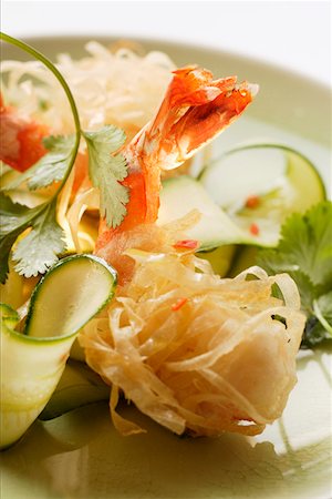 King prawns, fried in rice noodles, with courgette salad Stock Photo - Premium Royalty-Free, Code: 659-01844647