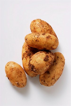 Several potatoes with soil Stock Photo - Premium Royalty-Free, Code: 659-01844760