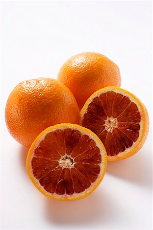 Whole and half blood oranges Foto de stock - Sin royalties Premium, Código: 659-01844803