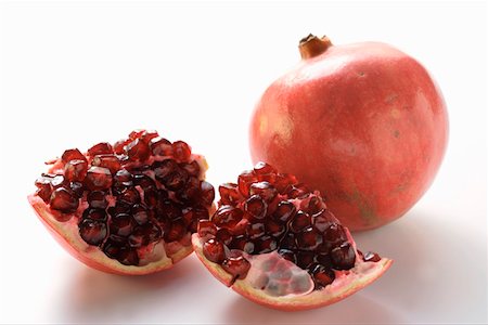 simsearch:659-01844953,k - Two pomegranates, one halved Stock Photo - Premium Royalty-Free, Code: 659-01844816