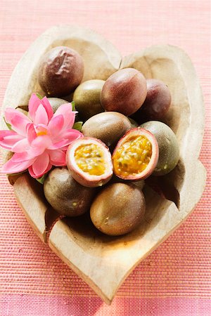 purple granadilla images - Passion fruits (Purple granadilla) in wooden bowl Stock Photo - Premium Royalty-Free, Code: 659-01844918