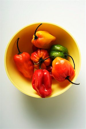 red and yellow capsicum types - Various chili peppers in yellow bowl Stock Photo - Premium Royalty-Free, Code: 659-01845046