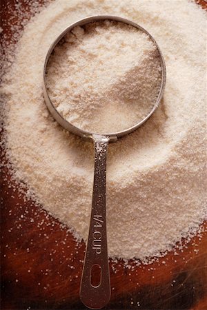 White cornmeal with measuring jug Stock Photo - Premium Royalty-Free, Code: 659-01845055