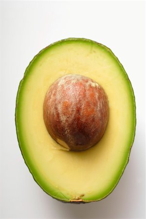 Half an avocado with stone Stock Photo - Premium Royalty-Free, Code: 659-01845059