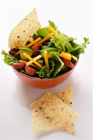 salad bowl isolated - Mexican salad with vegetables, cheese and tortilla chips Stock Photo - Premium Royalty-Free, Code: 659-01845077