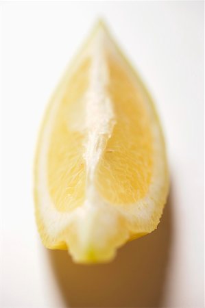 Wedge of lemon Stock Photo - Premium Royalty-Free, Code: 659-01845189
