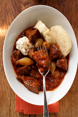 Goulash with Bohemian dumplings and sour cream Stock Photo - Premium Royalty-Free, Code: 659-01845225