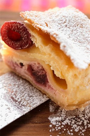 strudel - Piece of cherry strudel with icing sugar Stock Photo - Premium Royalty-Free, Code: 659-01845370