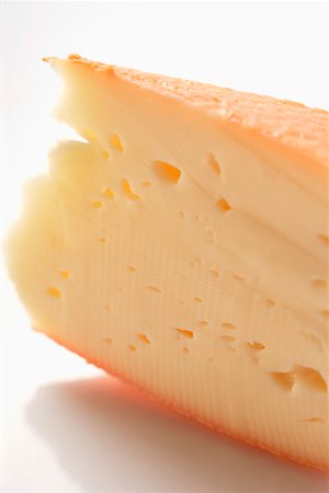 A piece of Chaumes cheese Stock Photo - Premium Royalty-Free, Code: 659-01845429