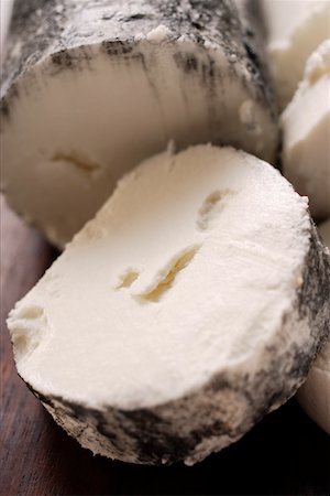 Goat's cheese with ash, slices cut Stock Photo - Premium Royalty-Free, Code: 659-01845423