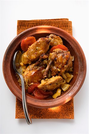 simsearch:659-01862628,k - Chicken tajine with tomatoes (N. Africa) Foto de stock - Sin royalties Premium, Código: 659-01845482