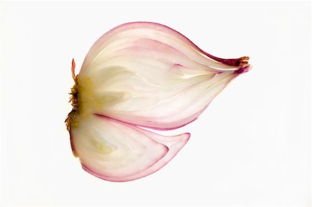 Red onion (lengthwise slice), backlit Foto de stock - Sin royalties Premium, Código: 659-01845534