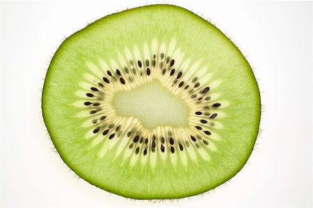 simsearch:659-01843575,k - Slice of kiwi fruit, backlit Stock Photo - Premium Royalty-Free, Code: 659-01845532